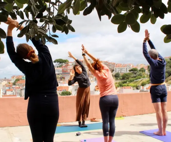 Small group rooftop yoga class in Lisbon with city views
